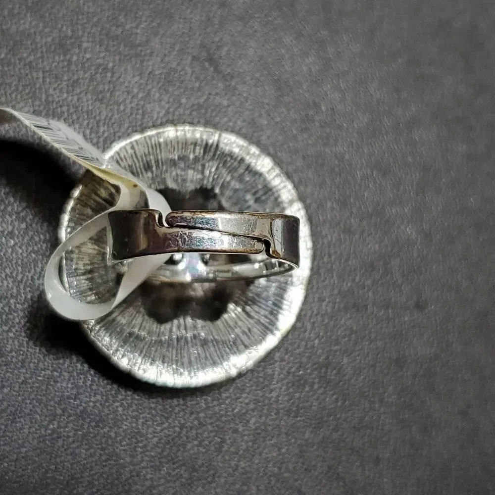 Silver tone circular sparkly ring